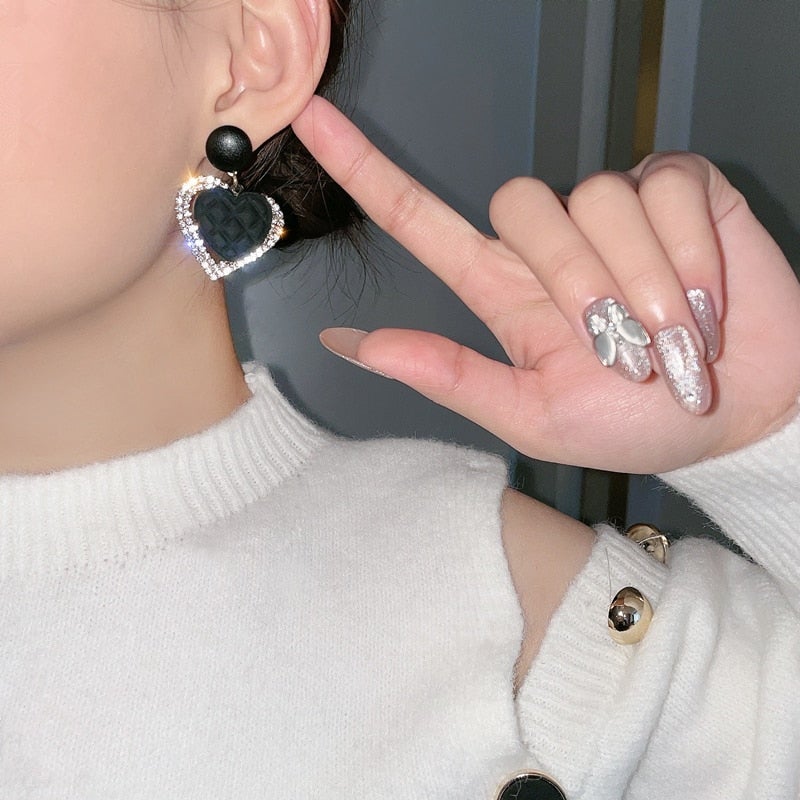 Boucles d’oreilles cœur noir en or