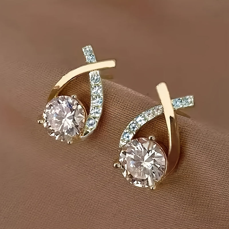 Boucles d’oreilles clous croix dorée en zirconium